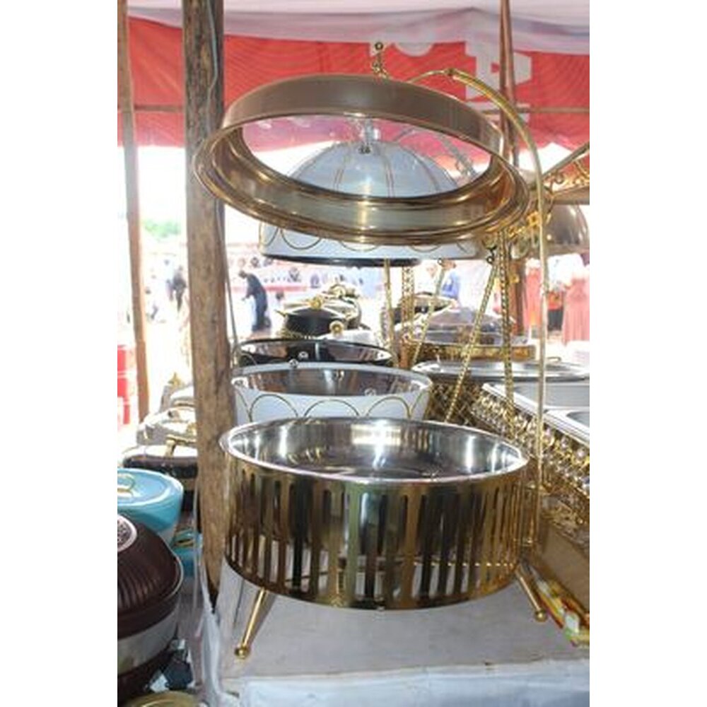 Gold round chafing dish with roll-top glass lid